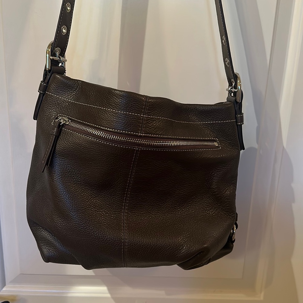 Brand new COACH leather bag. Perfect condition. Was a gift.